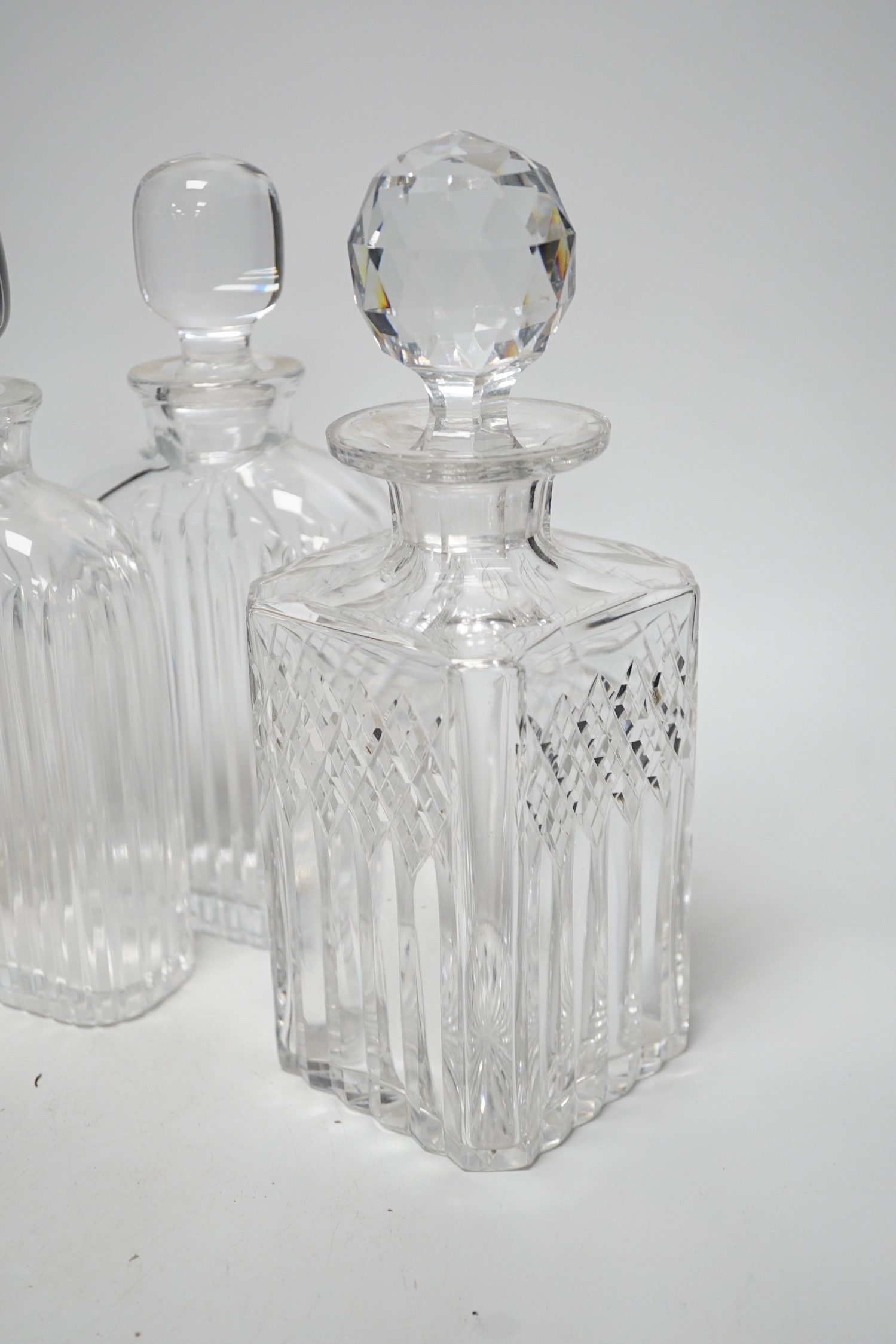 Five 20th century glass decanters, tallest 35cm